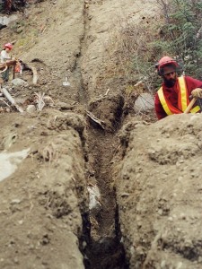 Manually dug trench for central pole drain, breaching berm, Fall 2001