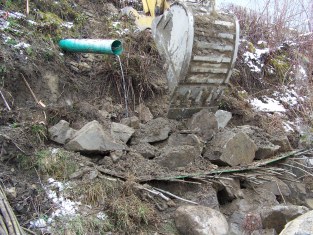Installation of vegetated riprap on eroded bank below storm water outfall