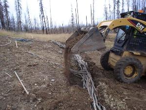 Backfilling of structure in trench (manual backfilling also done after machine work)