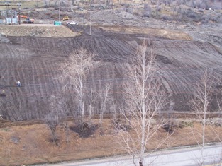 Soil spreading completed with bulldozer tracking, March 2006