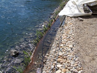 Section 2 during flooding, spring 2007, note upper portion of cuttings above water level 