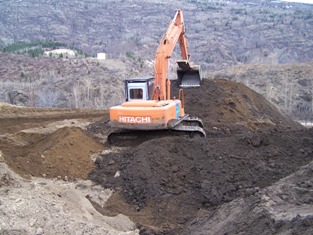 Spreading organic-enriched surface layer, March 2006