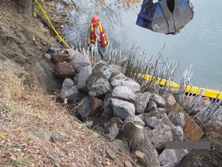 Placing next layer of riprap 