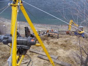 Cable/buggy system used to transport materials onto slope 